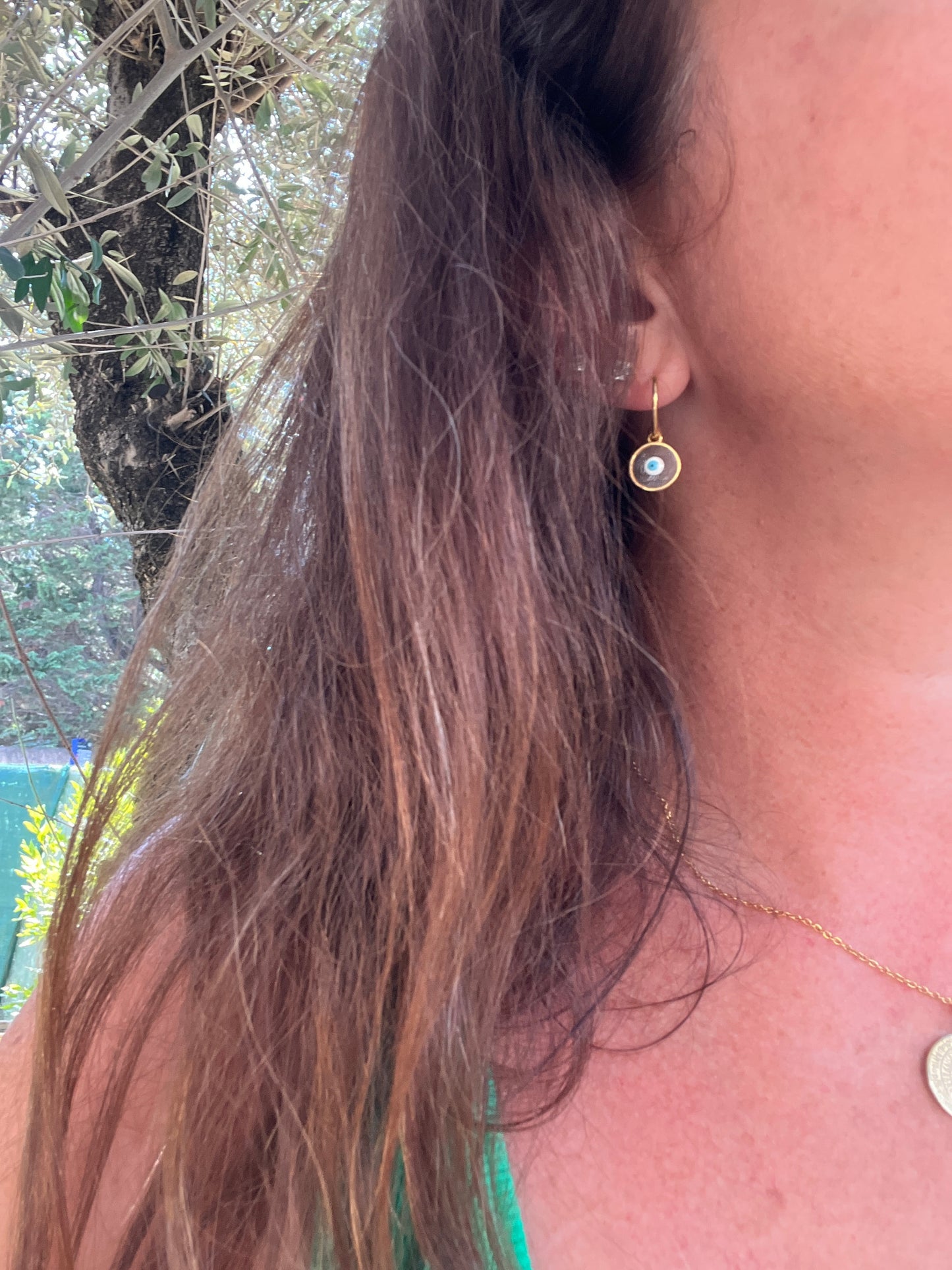 boucles d'oreilles dorée pendants oeil de protection