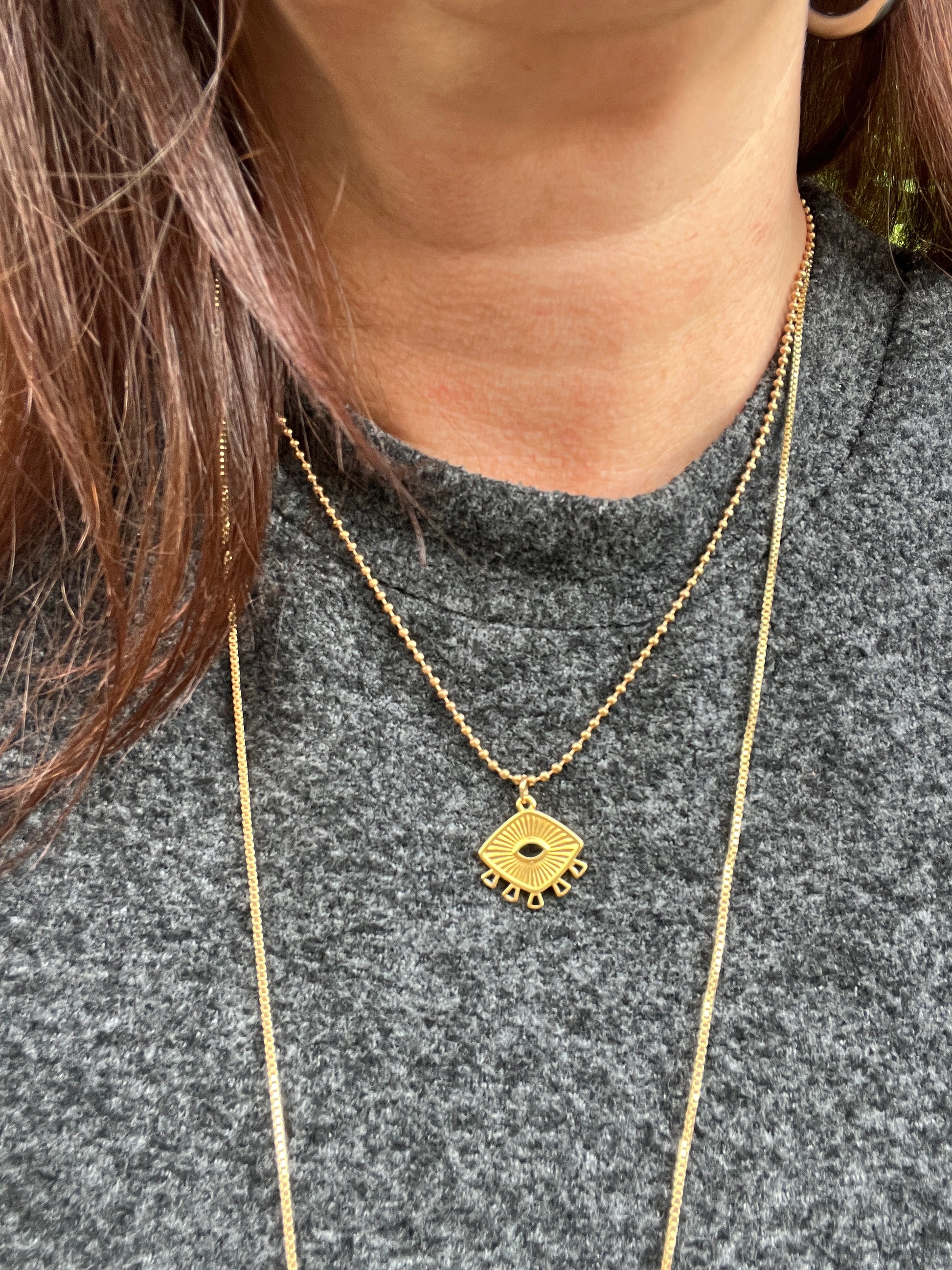 Collier acier inoxydable chaîne boule pendentif oeil noir.